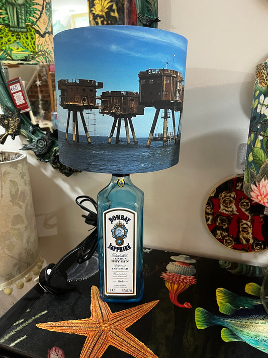 Upcycled Bombay Sapphire Gin Bottle lamp with Handmade 20cm Lampshade with the Whitstable Red Sands Maunsell Forts.