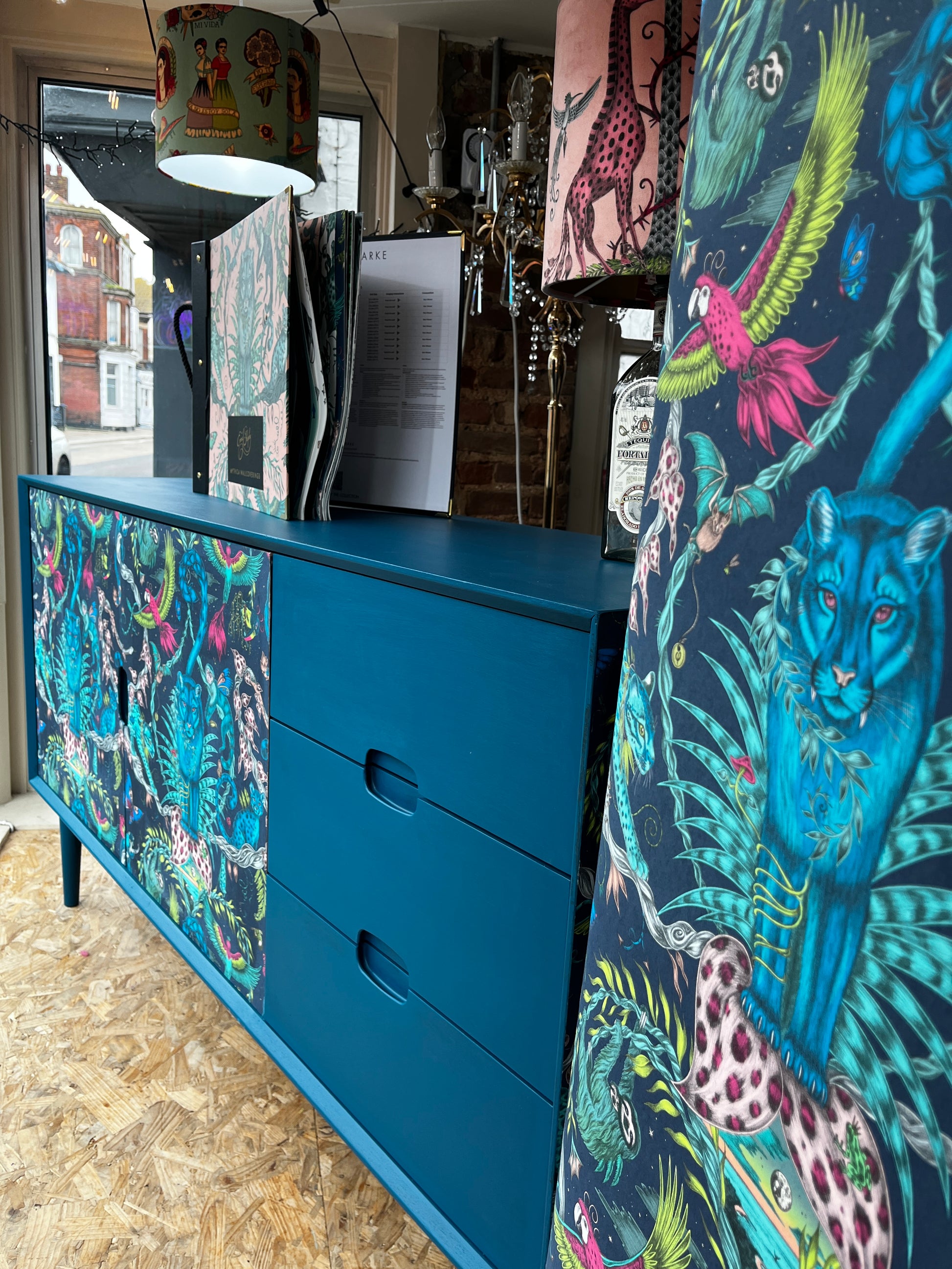 Shop window with large upcyled sideboard with Frenchic steel Teal and Emma Shipley Wallpaper Brits Love Vintage Whitstable
